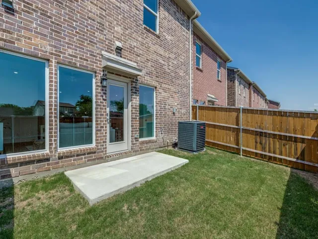 a view of an house with backyard porch and furniture