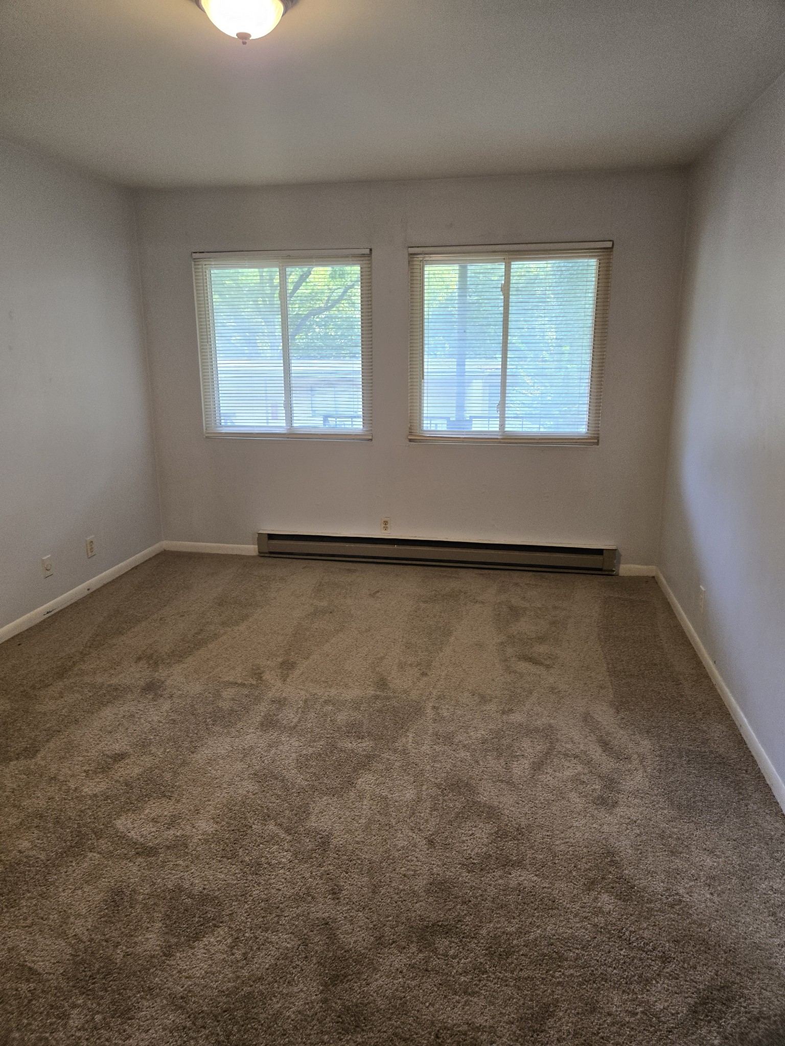550 Harding Place, Unit E120 Nashville, TN 37211 - Photo 5 of 8 an empty room with windows