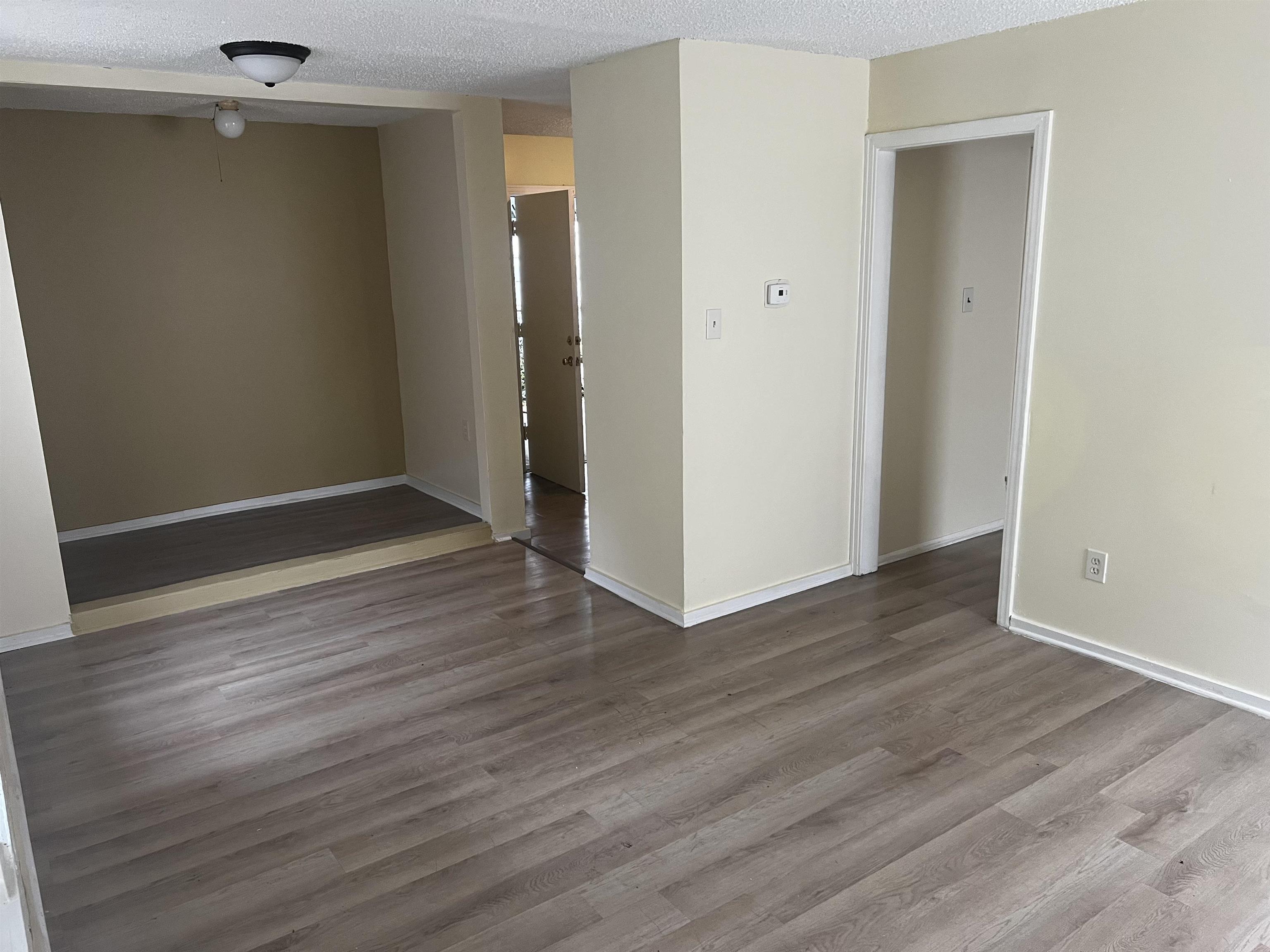 1336 James Street Memphis, TN 38106 - Photo 2 of 5 an empty room with wooden floor and closet