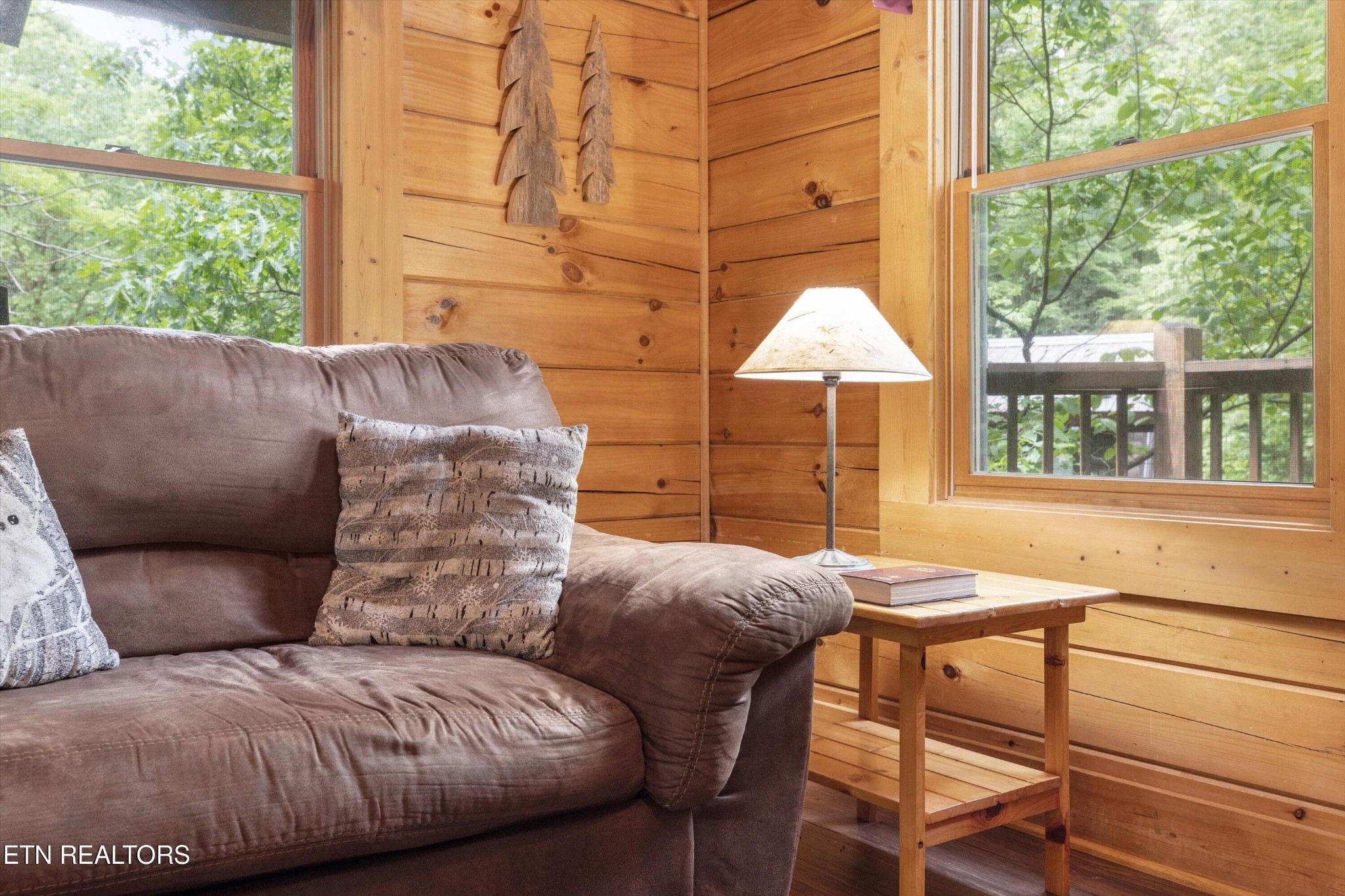 709 Grey Hawk Way Sevierville, TN 37863 - Photo 13 of 30 a living room with a couch and a large window
