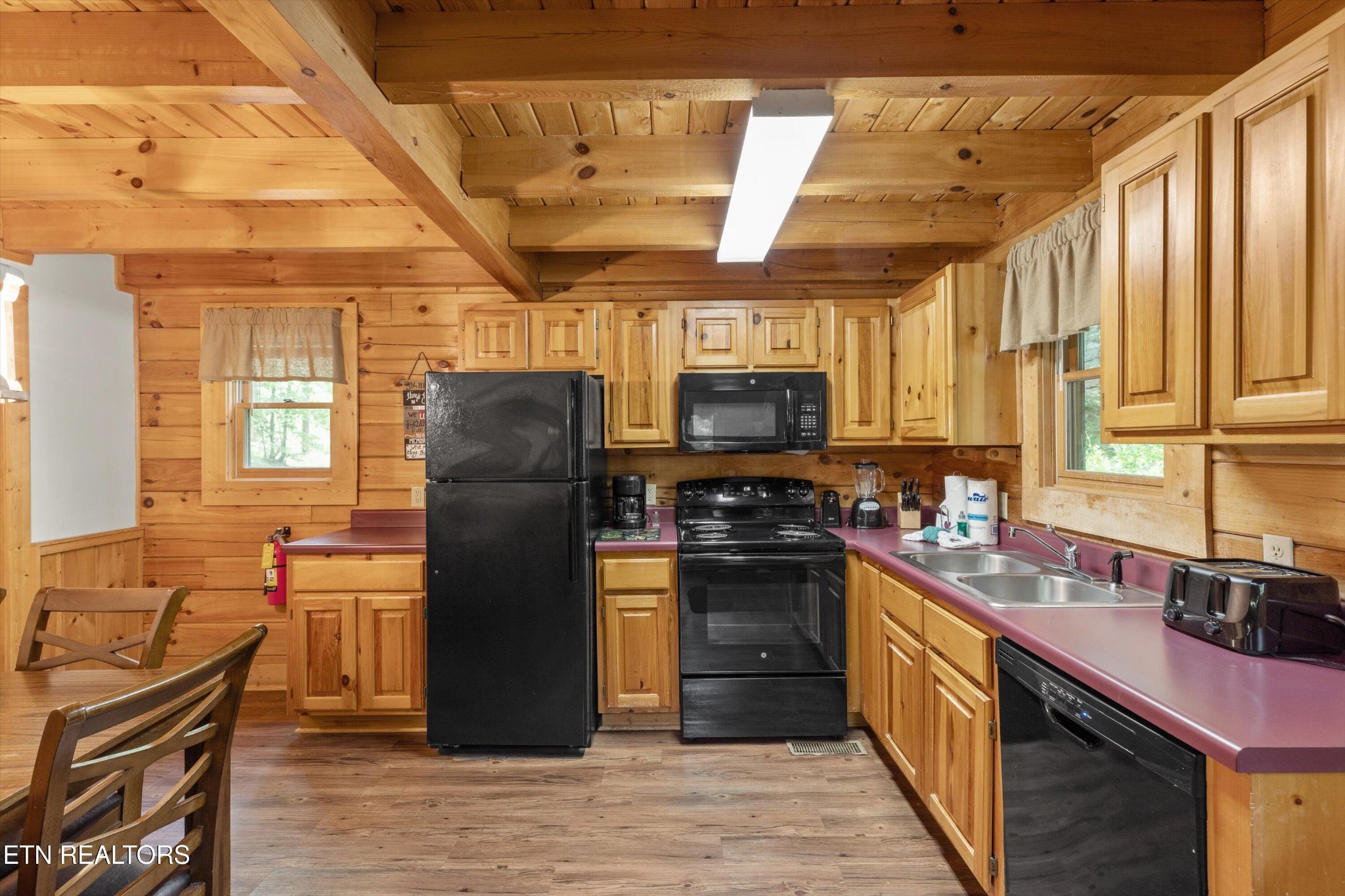 709 Grey Hawk Way Sevierville, TN 37863 - Photo 14 of 30 a kitchen with a refrigerator stove top oven and sink