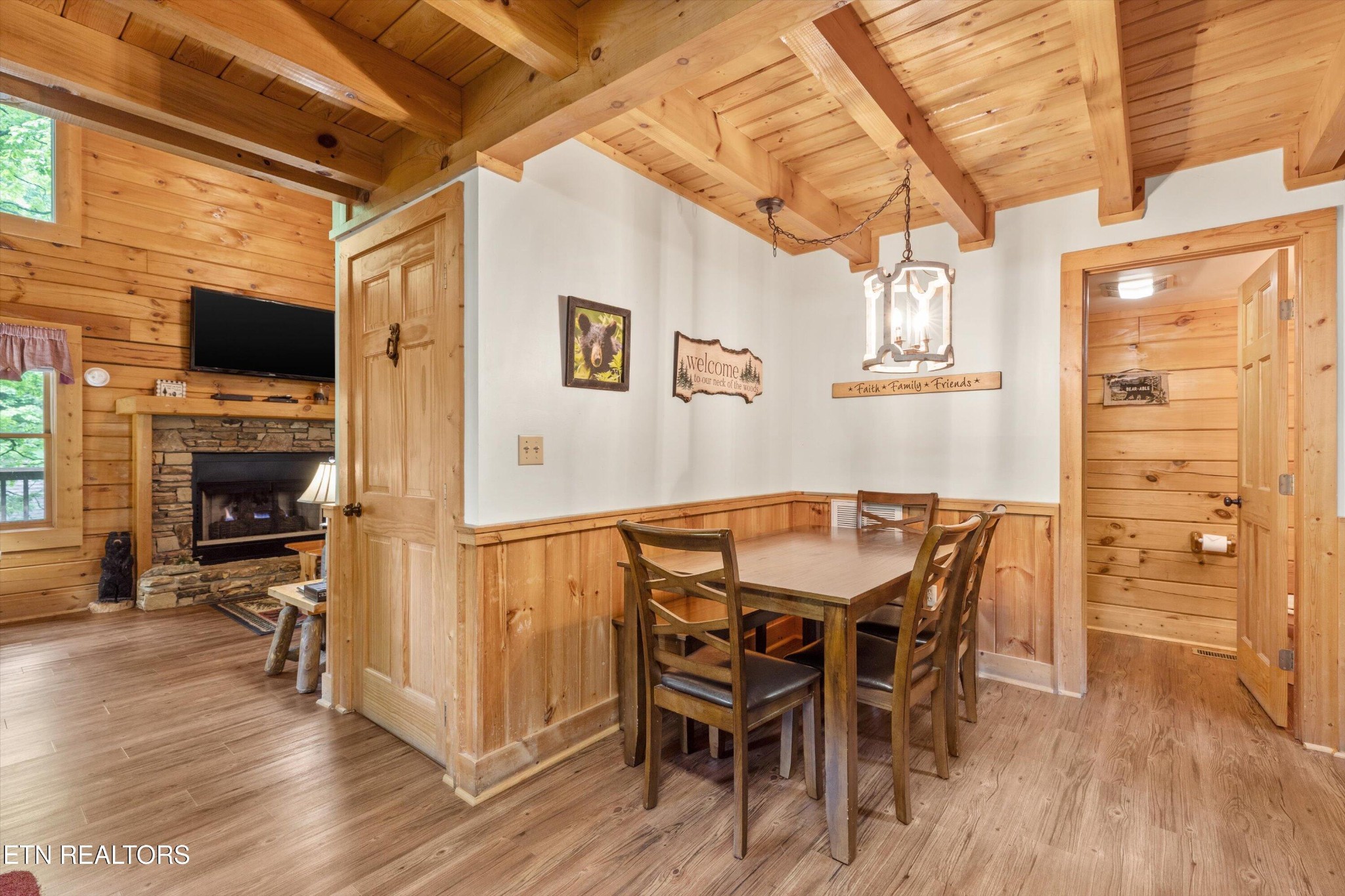 709 Grey Hawk Way Sevierville, TN 37863 - Photo 15 of 30 a view of a dining room with furniture window and wooden floor