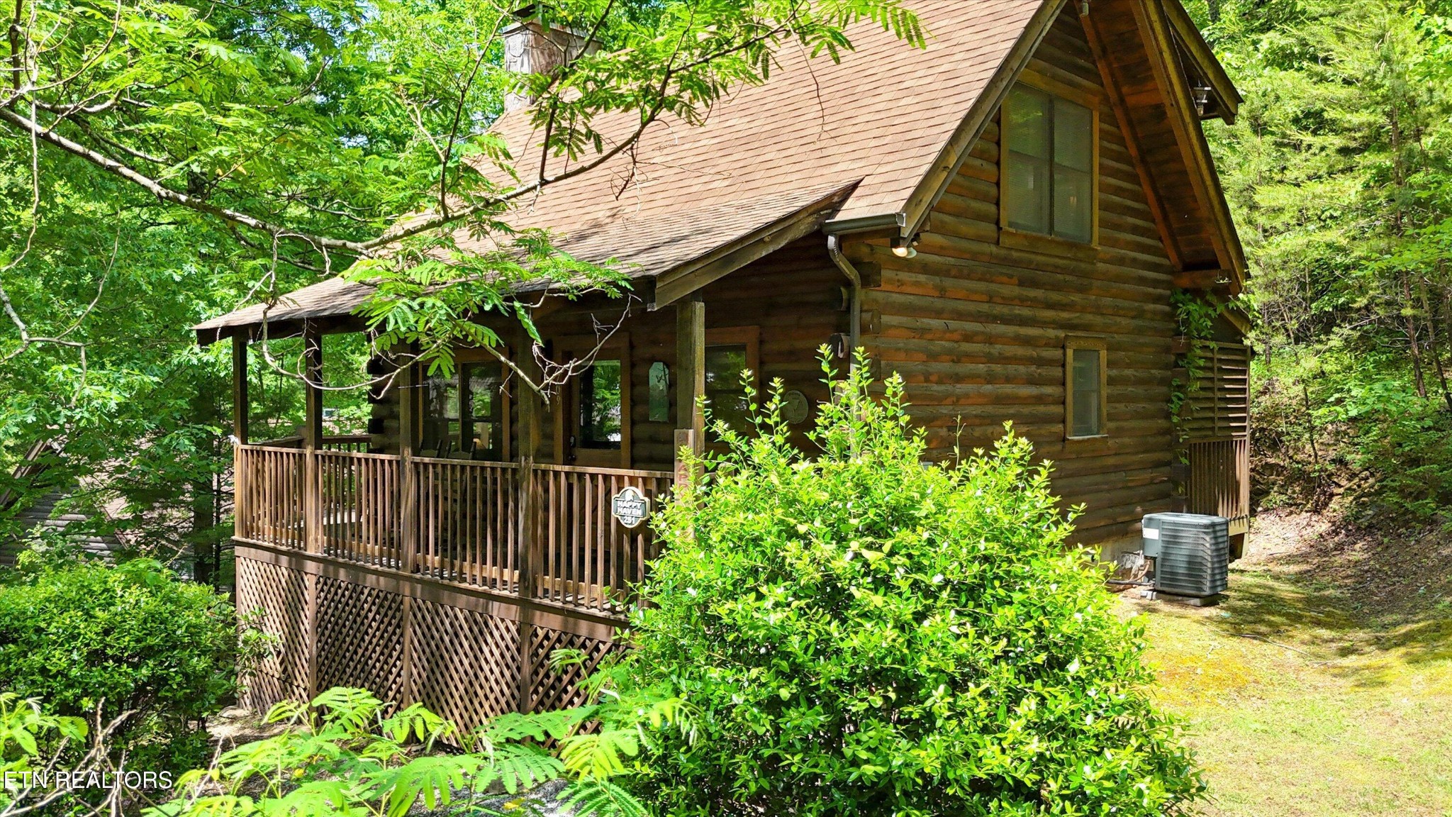709 Grey Hawk Way Sevierville, TN 37863 - Photo 2 of 30 a backyard of a house with lots of green space