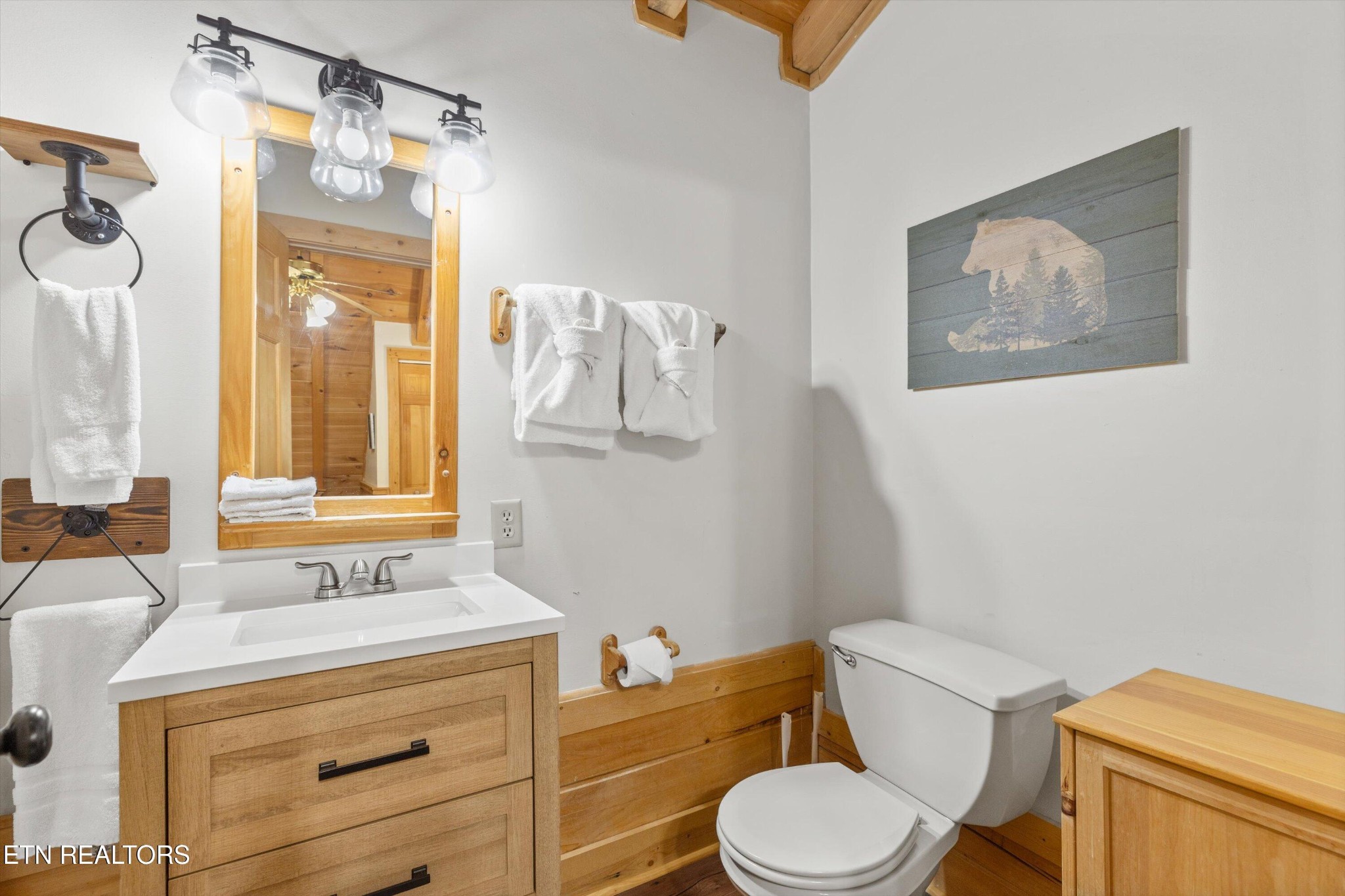 709 Grey Hawk Way Sevierville, TN 37863 - Photo 21 of 30 a bathroom with a granite countertop toilet sink and mirror