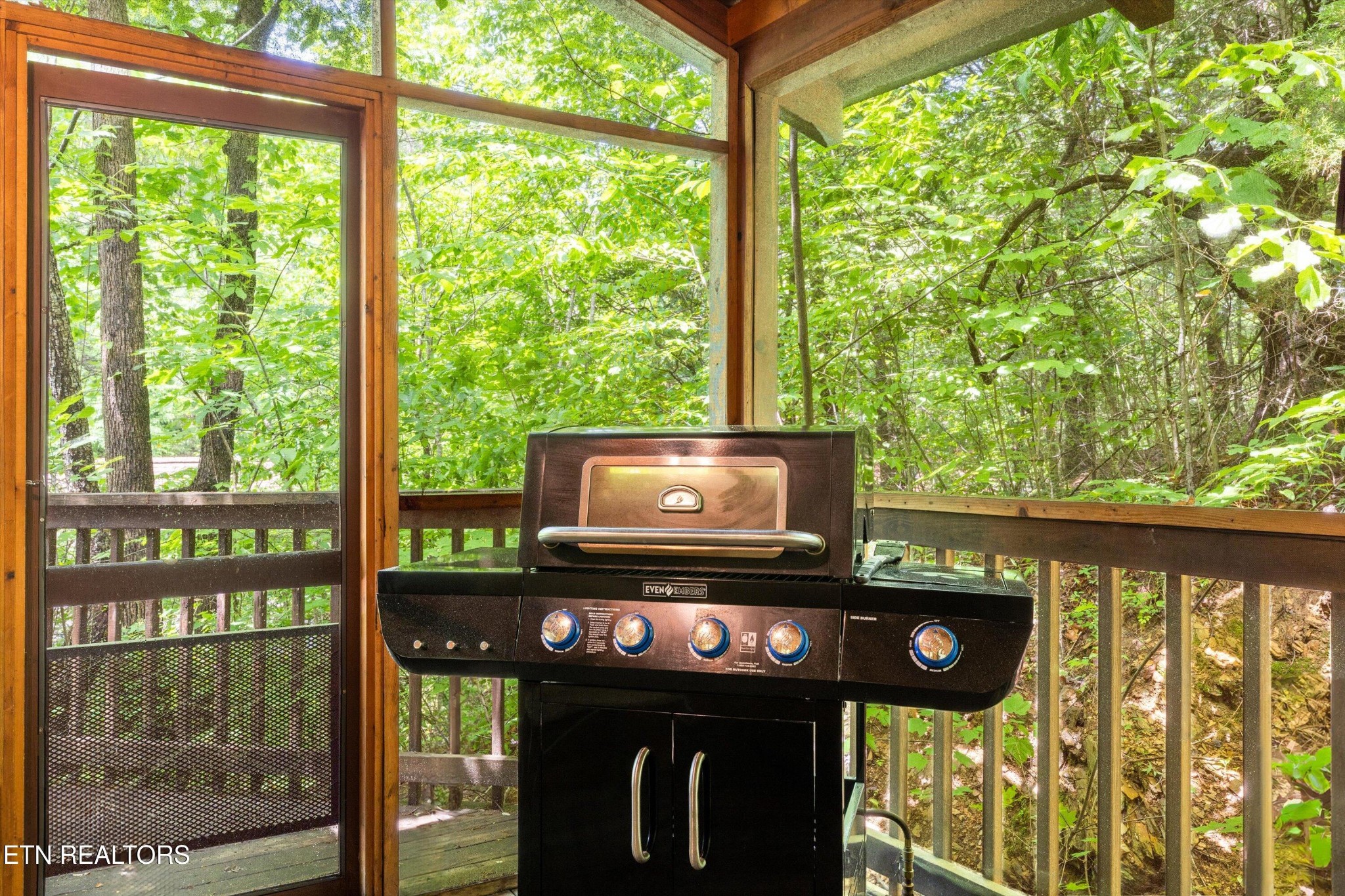 709 Grey Hawk Way Sevierville, TN 37863 - Photo 29 of 30 a view of a wooden bench and floor to ceiling windows
