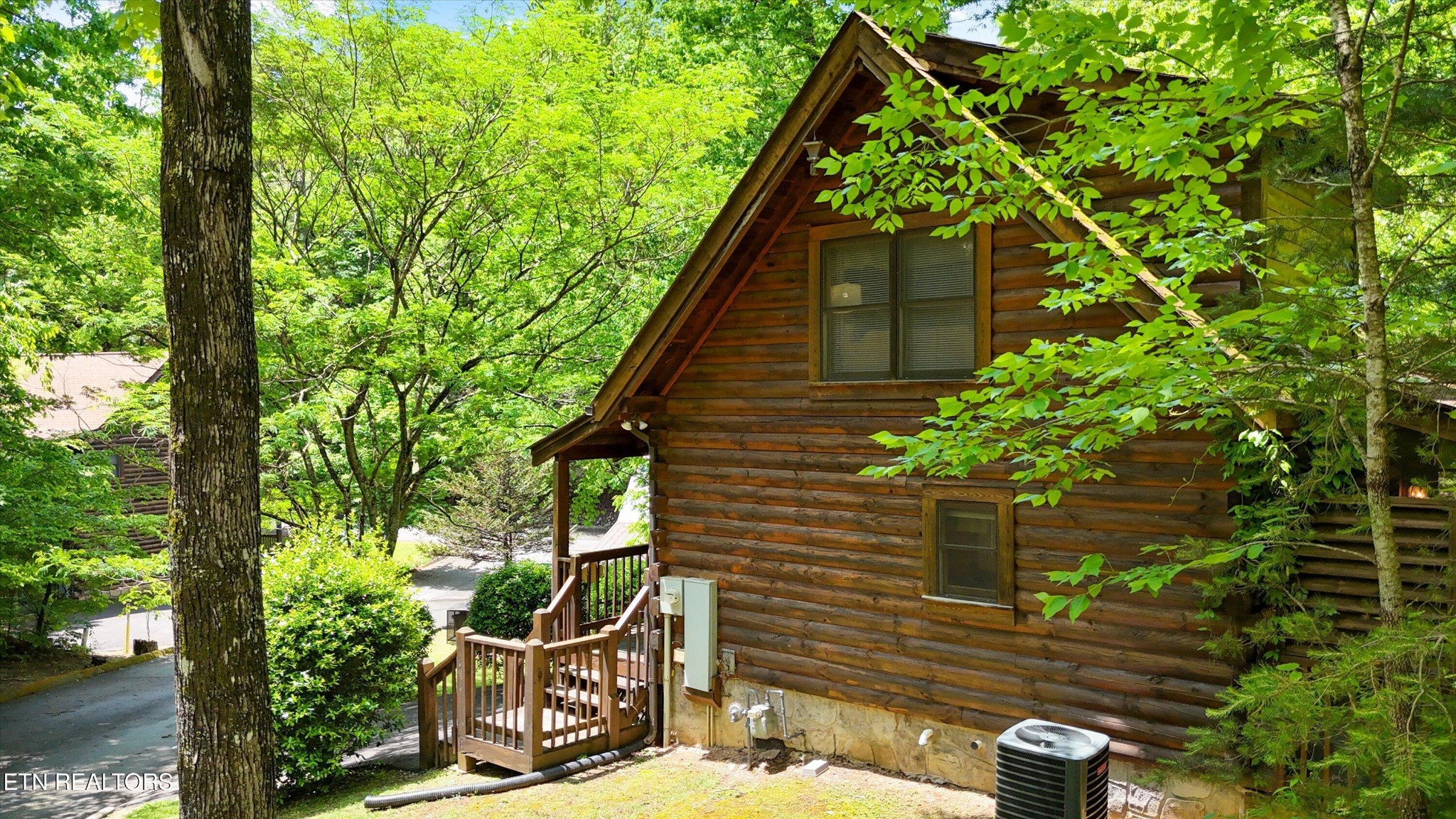 709 Grey Hawk Way Sevierville, TN 37863 - Photo 3 of 30 a backyard of a house with lots of green space