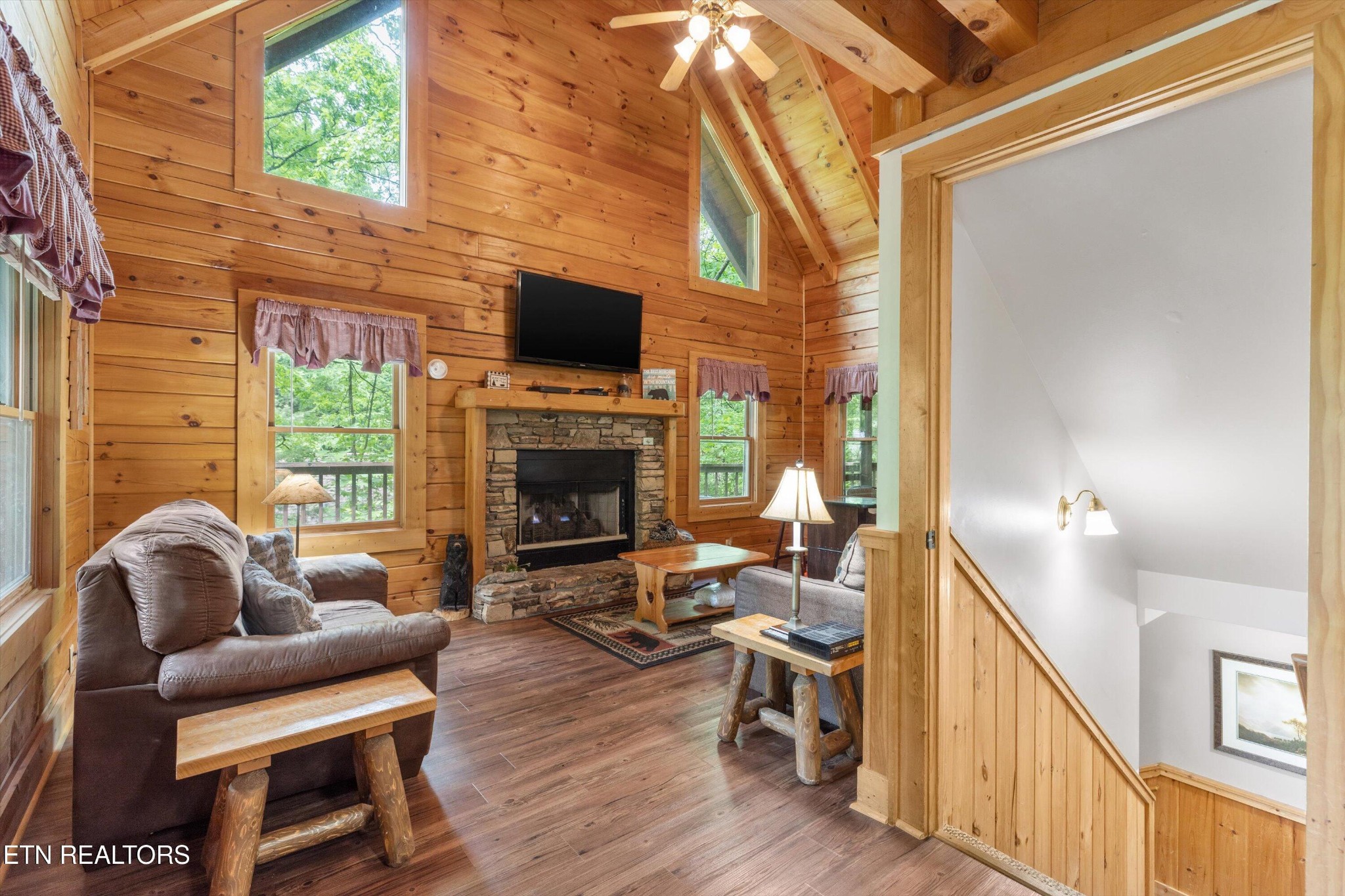 709 Grey Hawk Way Sevierville, TN 37863 - Photo 7 of 30 a living room with furniture a fireplace and a flat screen tv