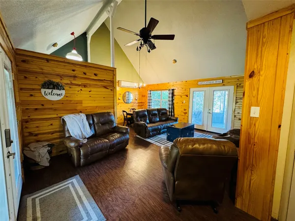 a view of a livingroom with furniture and a window