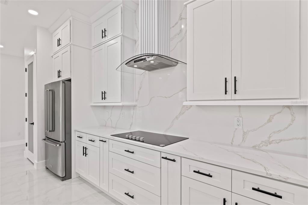 14060 Sydney Road Dover, FL 33527 - Photo 19 of 49 a kitchen with stainless steel appliances a refrigerator and cabinets