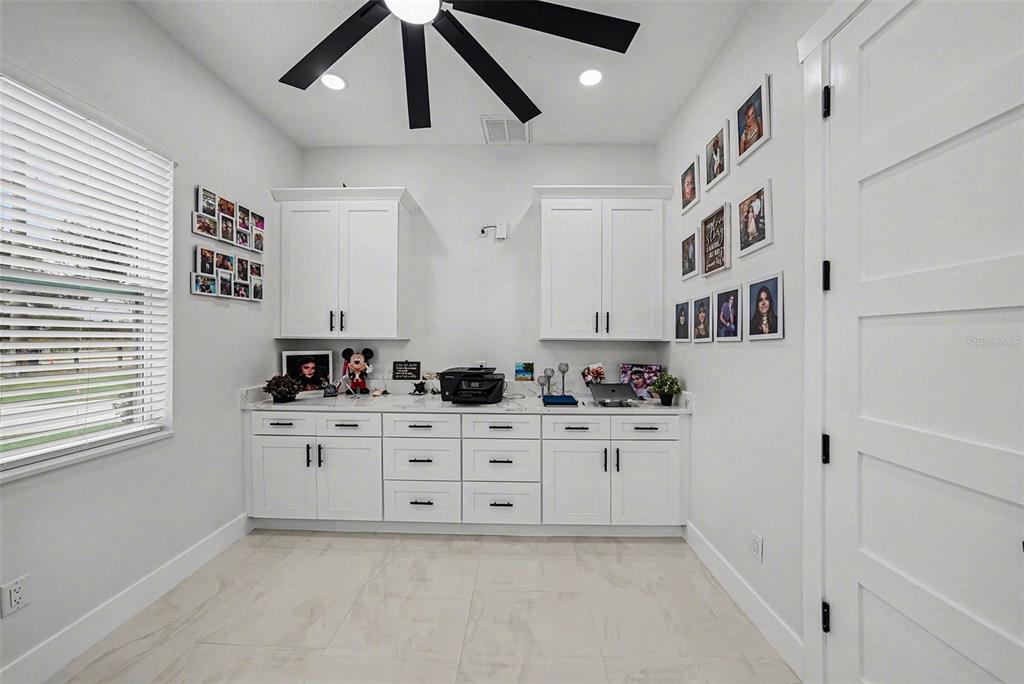14060 Sydney Road Dover, FL 33527 - Photo 23 of 49 a kitchen with cabinets and window