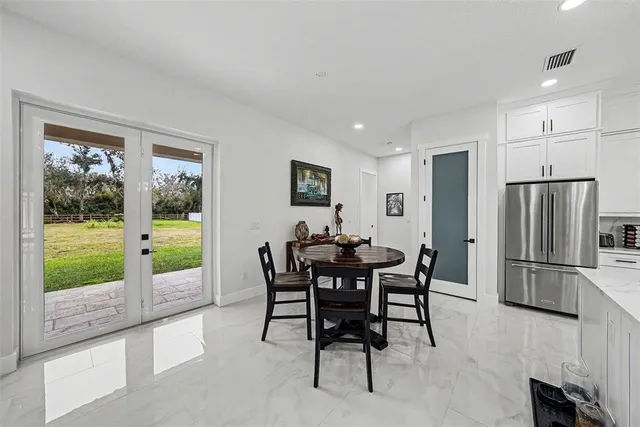 a view of a dining room with furniture window and outside view