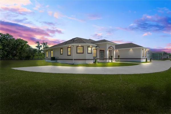 a view of a house with a big yard