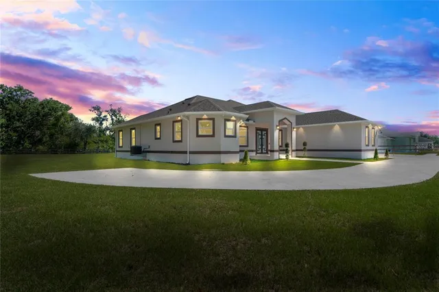 a view of a house with a big yard