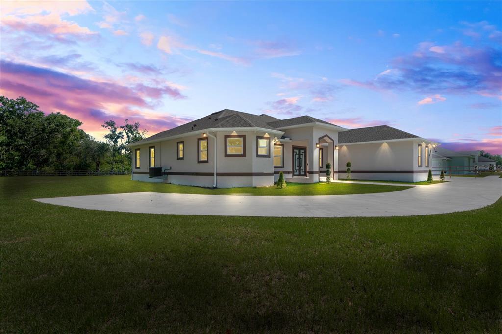 14060 Sydney Road Dover, FL 33527 - Photo 3 of 49 a view of a house with a big yard