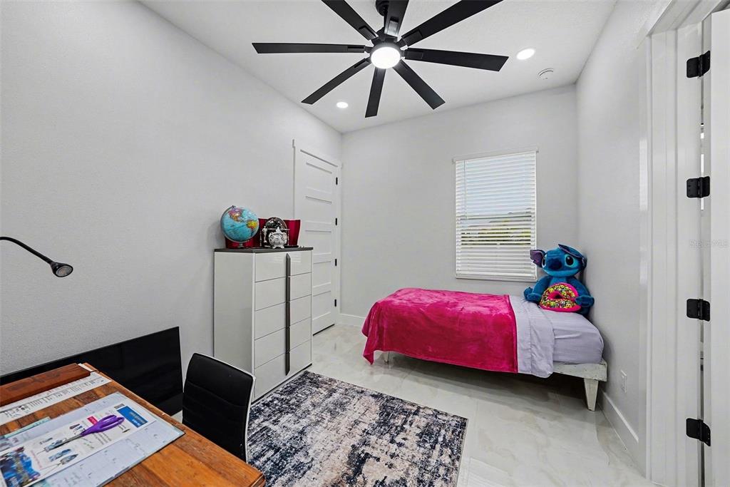 14060 Sydney Road Dover, FL 33527 - Photo 34 of 49 a bed room with a bed and a window