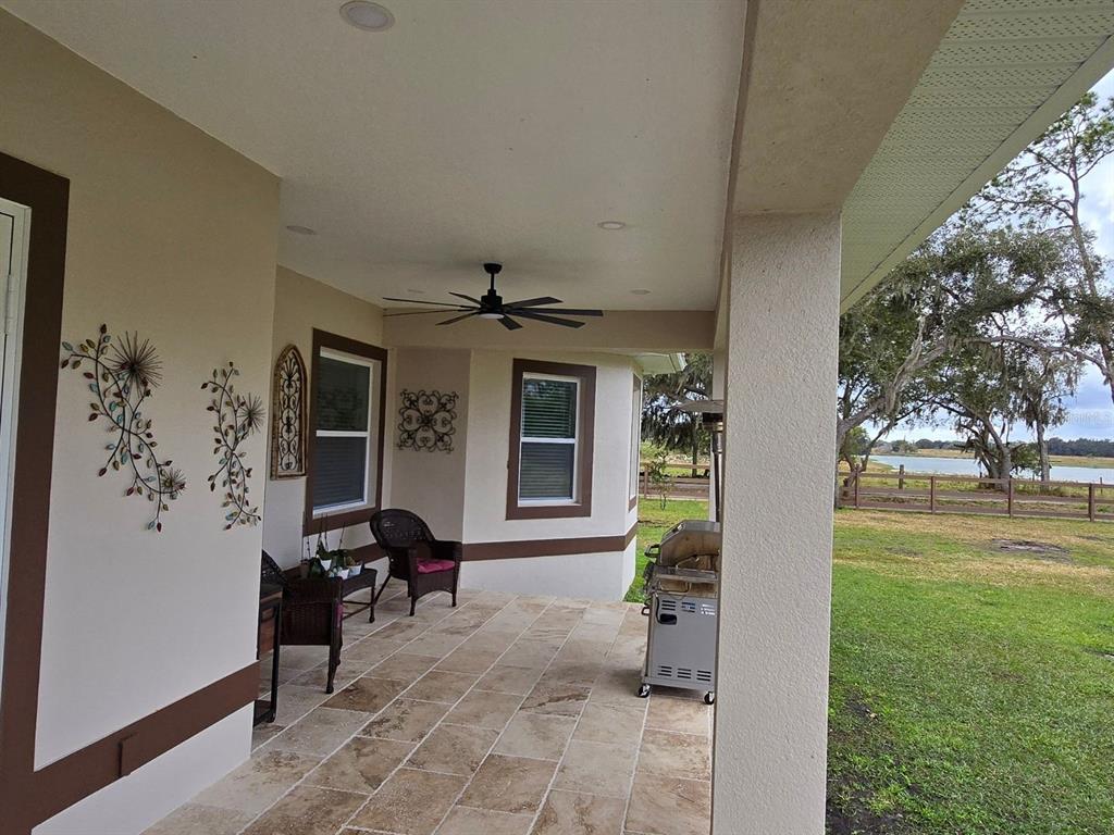 14060 Sydney Road Dover, FL 33527 - Photo 36 of 49 a view of a porch with furniture and garden