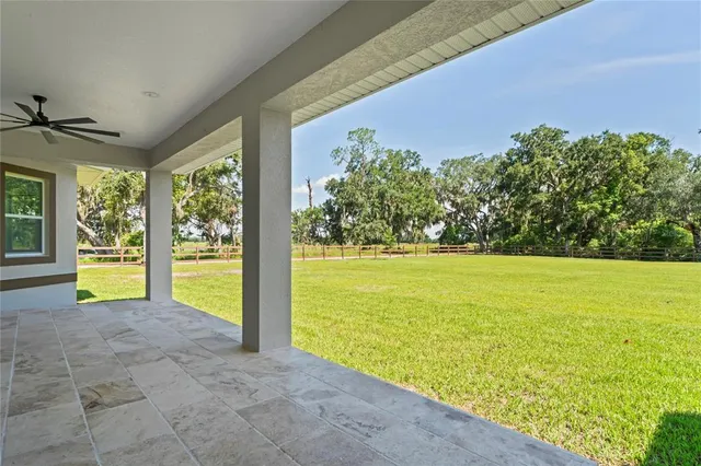 a view of swimming pool with an outdoor space and seating area