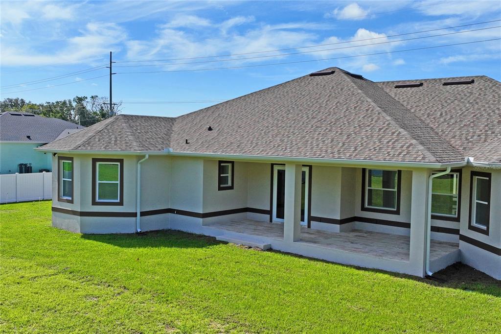 14060 Sydney Road Dover, FL 33527 - Photo 42 of 49 a view of a house with a garden