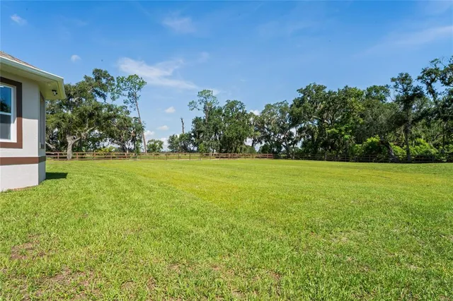 a view of a garden with a building in the background