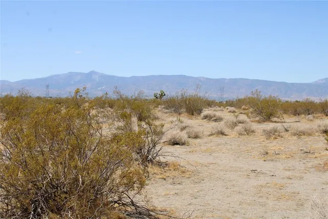 a view of mountain with sunset view