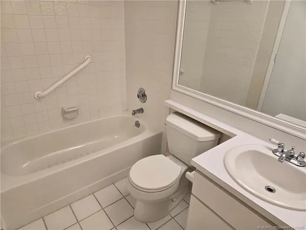 a bathroom with a sink a toilet and bathtub