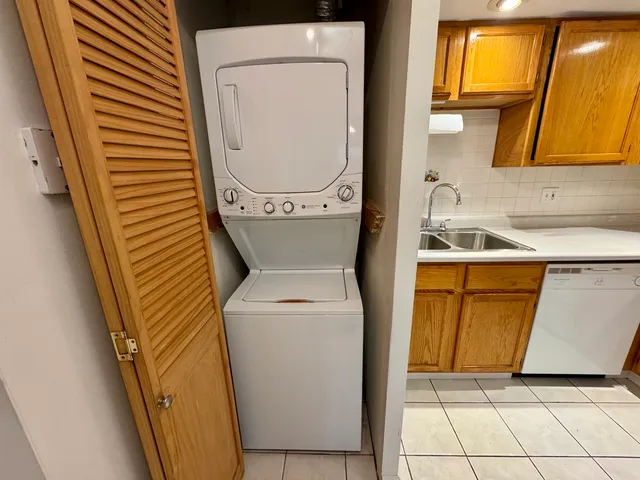 an aerial view of a house with a garden and lake view