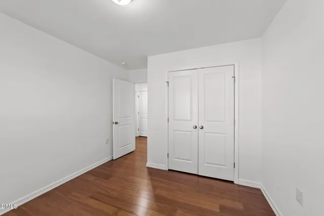 a view of room with hardwood floor