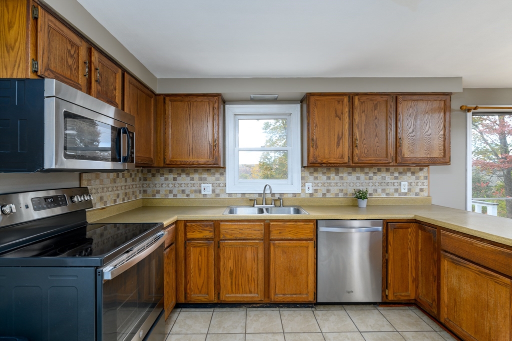 9 Sczygiel Road Ware, MA 01082 - Photo 16 of 29 a kitchen with a sink stove top oven and cabinets