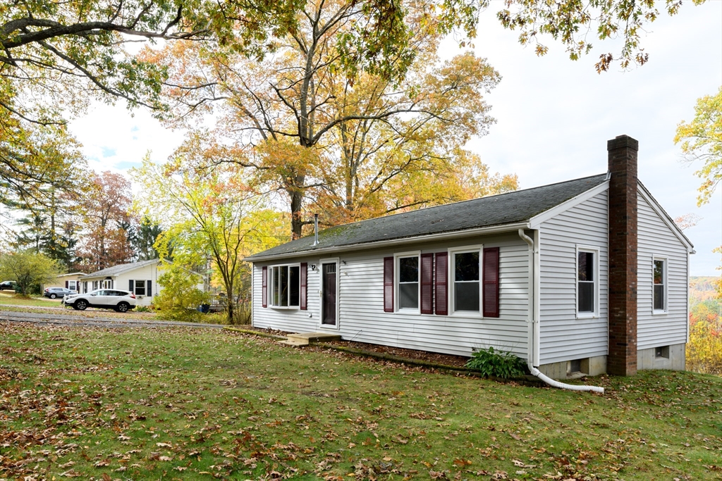 9 Sczygiel Road Ware, MA 01082 - Photo 2 of 29 a backyard of a house with yard and outdoor seating