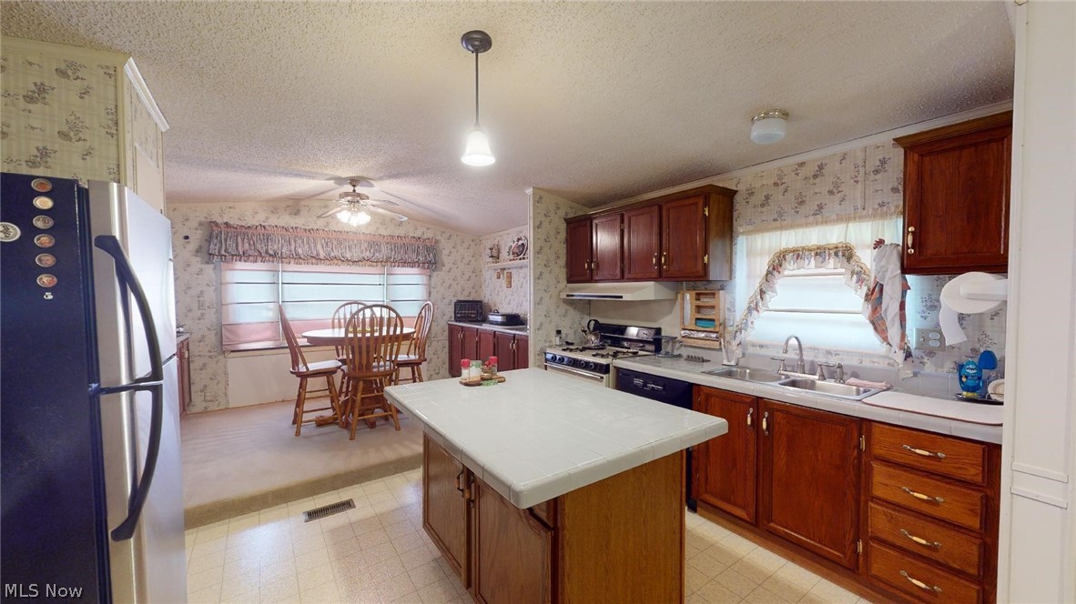 2018 Murphytown Road Davisville, WV 26142 - Photo 13 of 20 Kitchen looking into the dining room, dining room has storage cabinets on both side of the walls