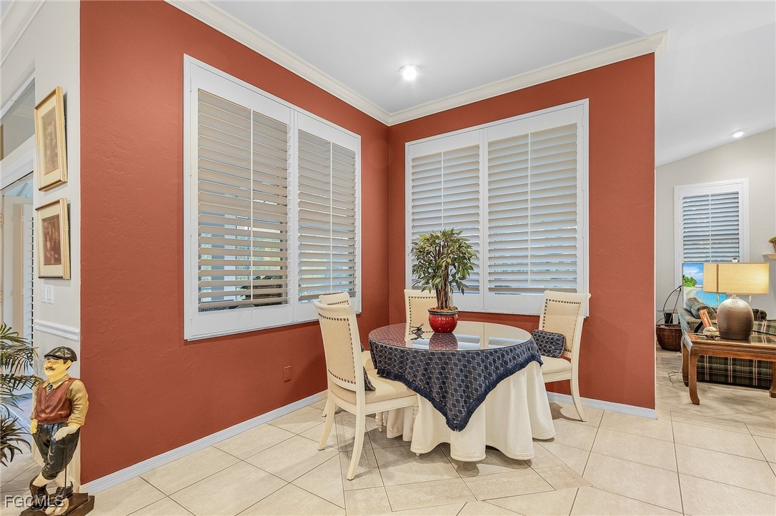15661 Fiddlesticks Boulevard Fort Myers, FL 33912 - Photo 14 of 42 a dining room with furniture and window