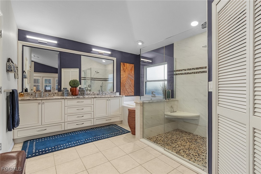 15661 Fiddlesticks Boulevard Fort Myers, FL 33912 - Photo 22 of 42 a bathroom with a sink toilet and shower