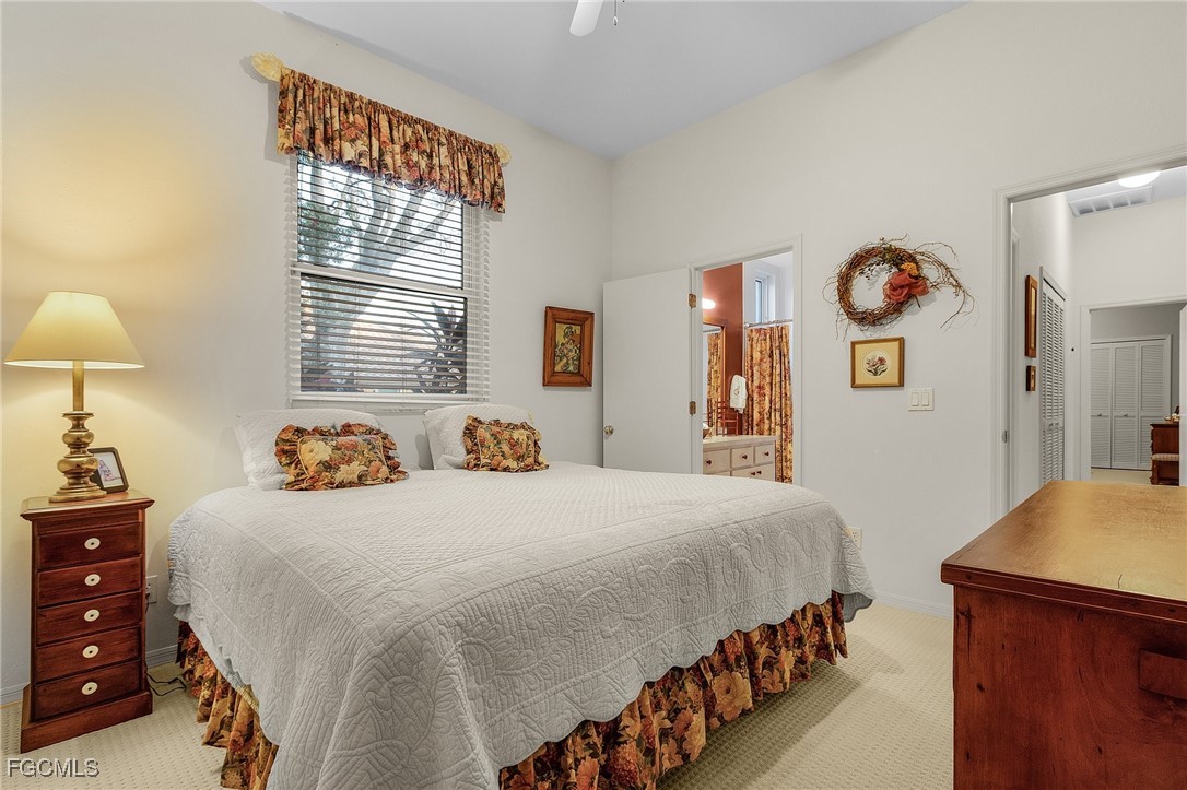 15661 Fiddlesticks Boulevard Fort Myers, FL 33912 - Photo 28 of 42 a bedroom with bed and window