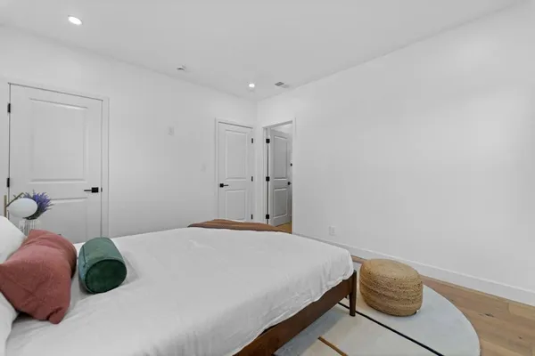 a bedroom with a bed and window