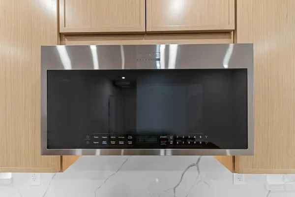 a kitchen with granite countertop a stove and a sink