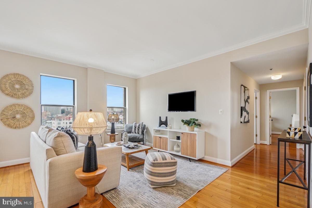 1621 T Street Northwest, Unit PH02 Washington, DC 20009 - Photo 11 of 30 a living room with furniture a flat screen tv and kitchen view
