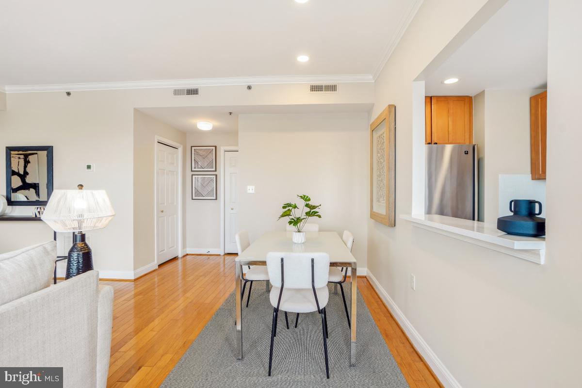 1621 T Street Northwest, Unit PH02 Washington, DC 20009 - Photo 12 of 30 a living room with furniture and a chandelier