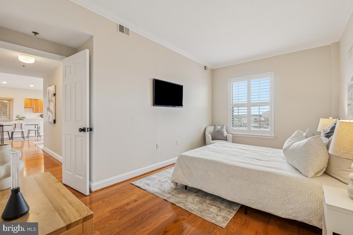 1621 T Street Northwest, Unit PH02 Washington, DC 20009 - Photo 18 of 30 a bedroom with a bed and large window