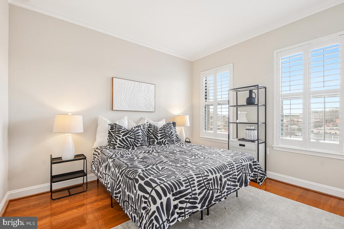 1621 T Street Northwest, Unit PH02 Washington, DC 20009 - Photo 22 of 30 a bedroom with a bed and a window
