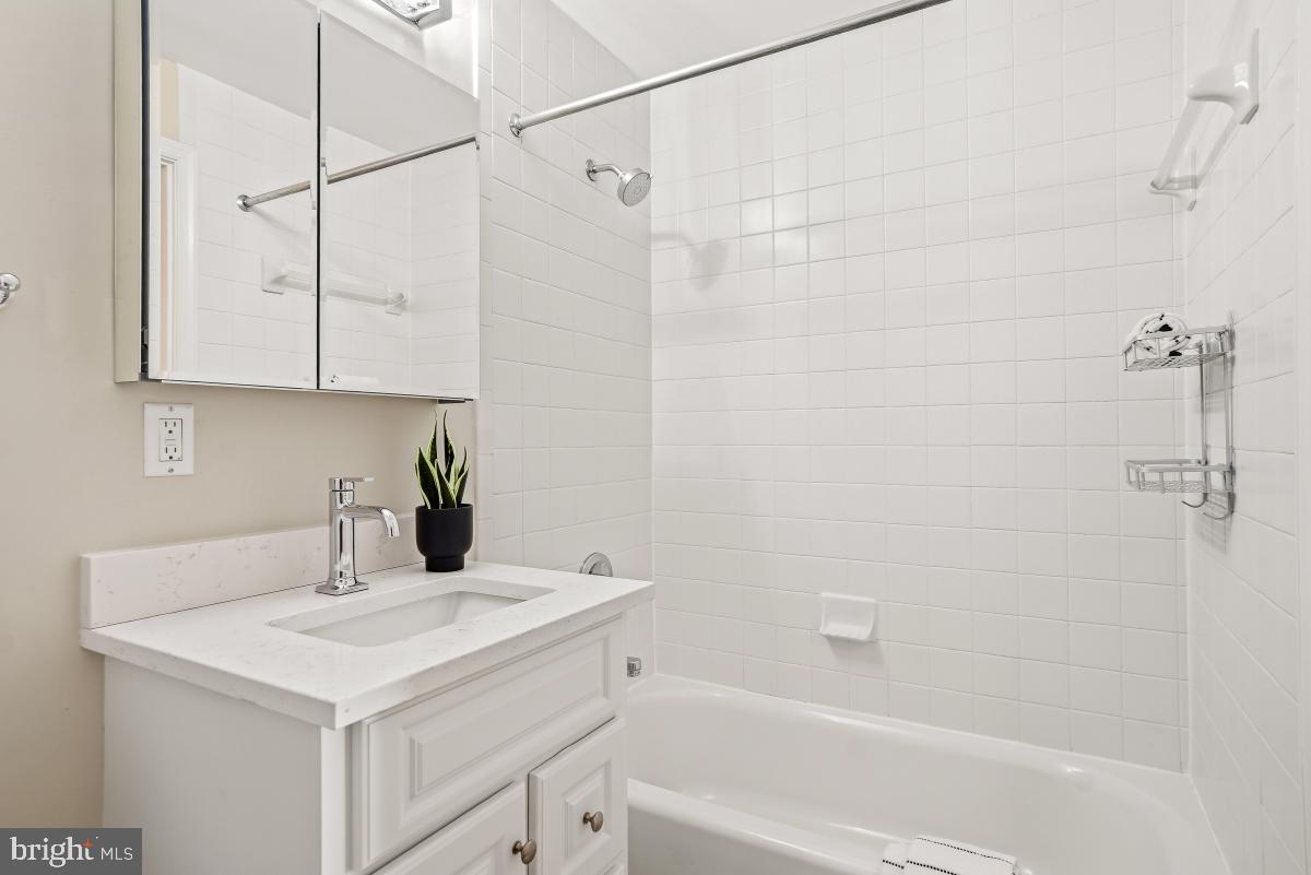 1621 T Street Northwest, Unit PH02 Washington, DC 20009 - Photo 24 of 30 a bathroom with a sink and a bathtub