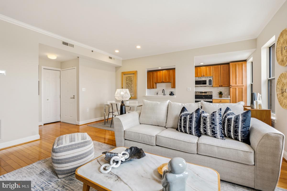 1621 T Street Northwest, Unit PH02 Washington, DC 20009 - Photo 8 of 30 a living room with furniture and a large window