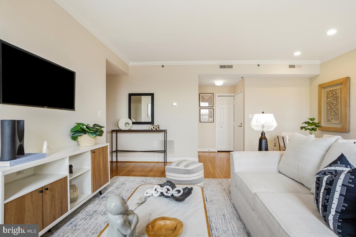 1621 T Street Northwest, Unit PH02 Washington, DC 20009 - Photo 9 of 30 a living room with furniture and a flat screen tv