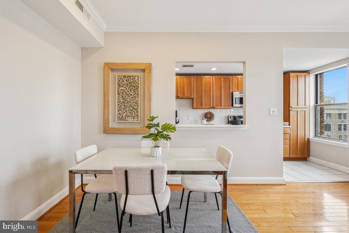 1621 T Street Northwest, Unit PH02 Washington, DC 20009 - Photo 10 of 30 a dining room with furniture and window