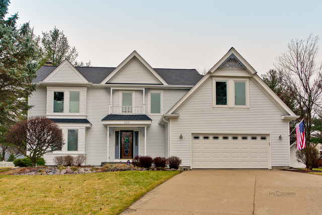 233 Perth Road Cary, IL 60013 - Photo 1 of 24 a front view of a house with a yard