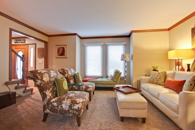 233 Perth Road Cary, IL 60013 - Photo 4 of 24 a living room with furniture and a large window