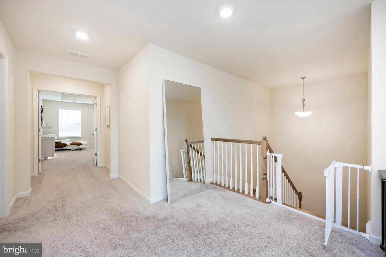 427 Lee Place Exton, PA 19341 - Photo 19 of 33 Spacious hallway with inviting natural light.