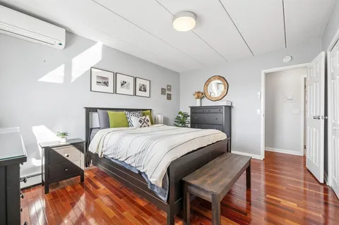 a bedroom with a bed and a table