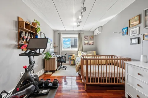 a bedroom with furniture and a window