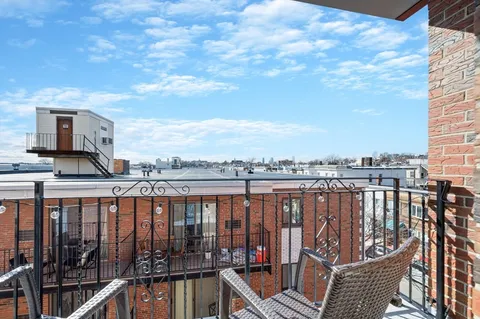 a view of balcony with furniture