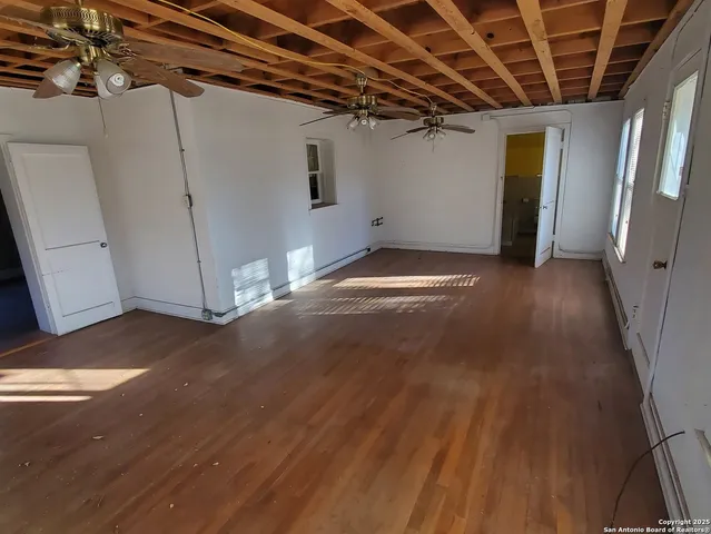 a view of a chairs and table in the patio